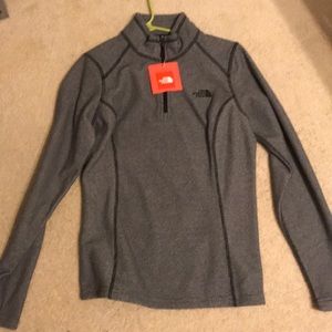 Grey stripped north face half zip.